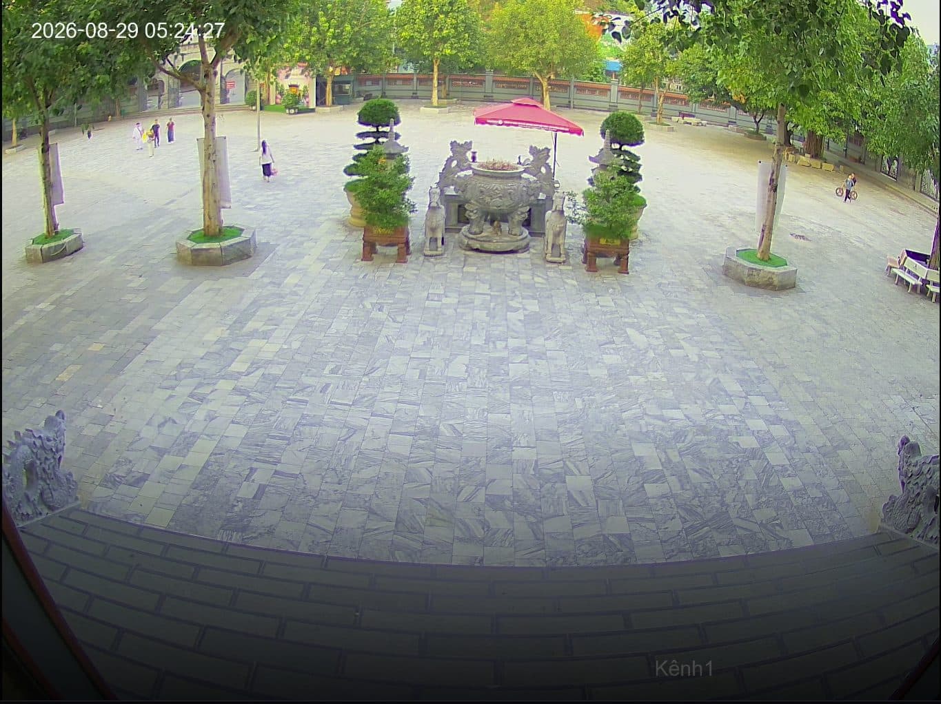 Main courtyard camera: large incense burner in the temple yard at dawn